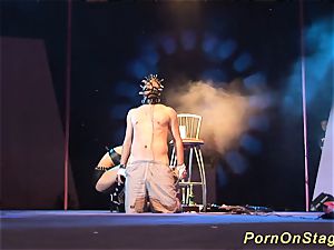 kinky fetish syringe demonstrate on stage